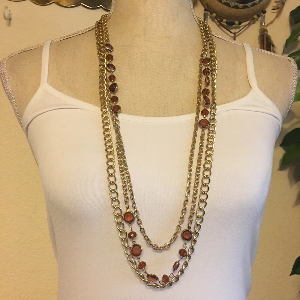 Triple strand gold tone chain topaz necklace